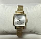 Tissot T058109A Quartz Silver Dial Gold Plated Bracelet Lady Watch