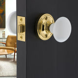 Nostalgic Warehouse 702208 Classic Rosette With White Porcelain Door Knob Passage 2.375in Polished Brass