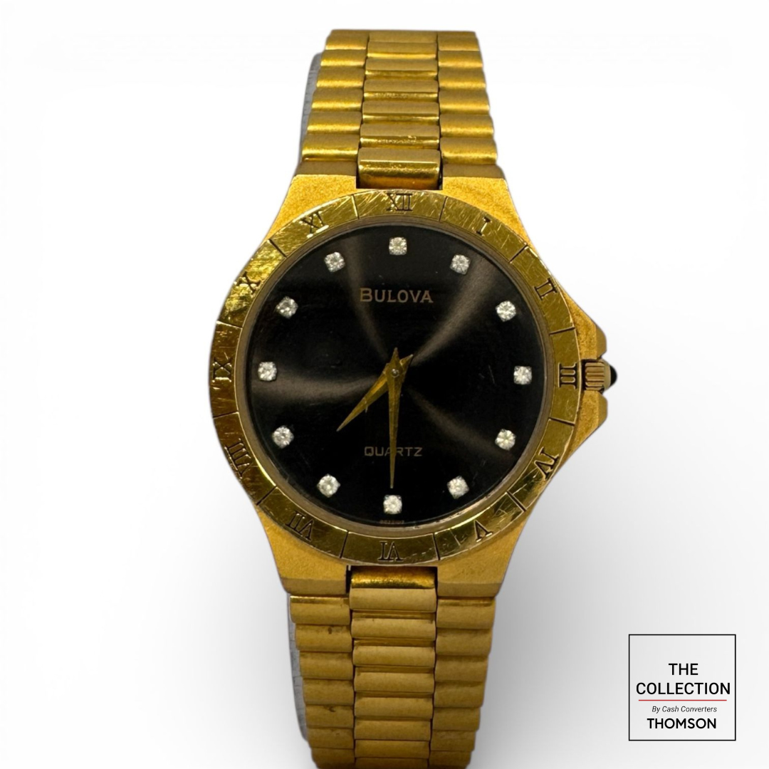 Vintage Bulova  gold-plated Watch featuring a black dial with Crystal hour markers and a Roman numeral bezel
