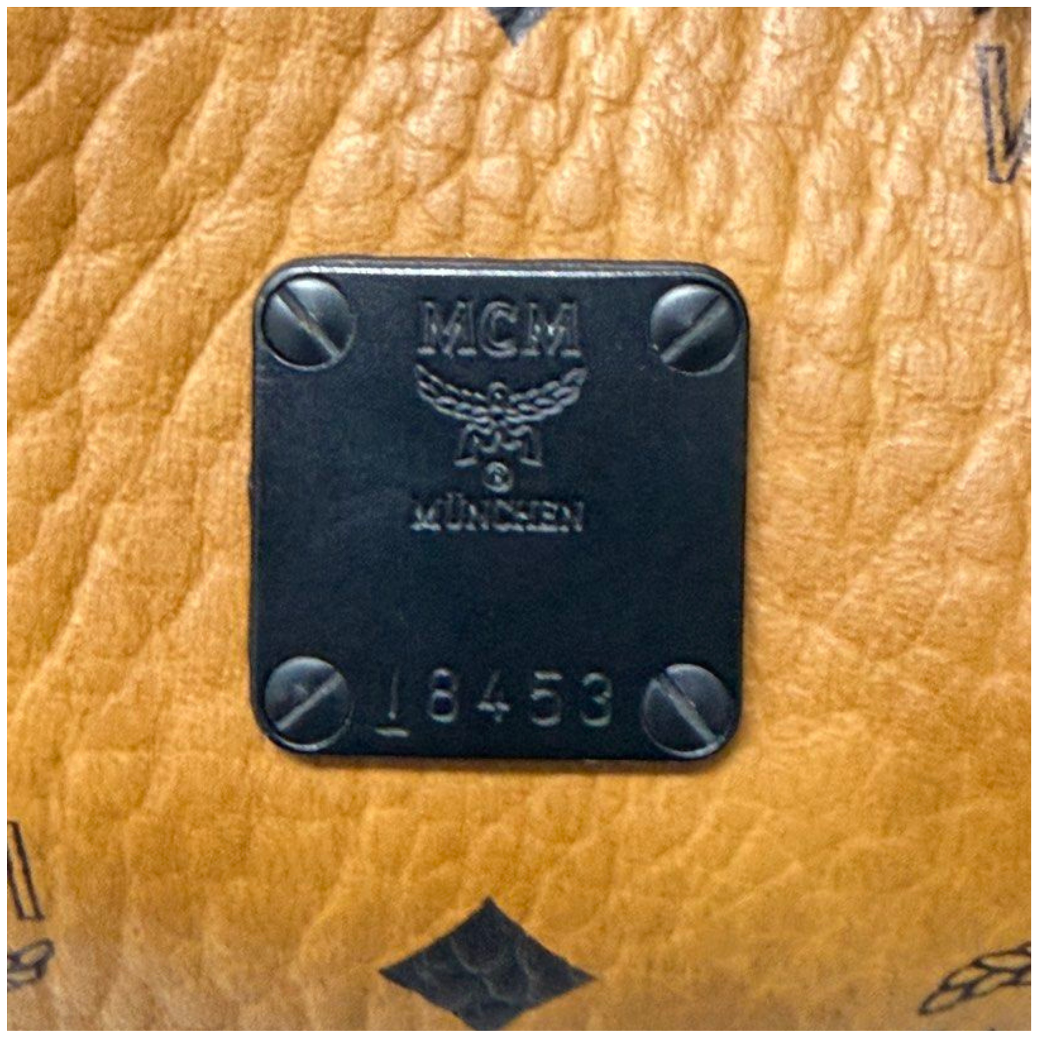 MCM Stark backpack in Visetos Cognac and Black Nappa Leather