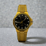 Vintage Bulova  gold-plated Watch featuring a black dial with Crystal hour markers and a Roman numeral bezel