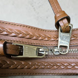 Gucci Sukey handbag crafted from the brand's iconic beige and brown GG canvas with brown leather trim.