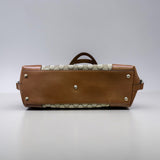 Gucci Sukey handbag crafted from the brand's iconic beige and brown GG canvas with brown leather trim.