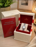 Omega De Ville Ladies Quartz Watch with a silver-tone dial, Roman numeral hour markers, and a stainless steel bracelet 22 cm